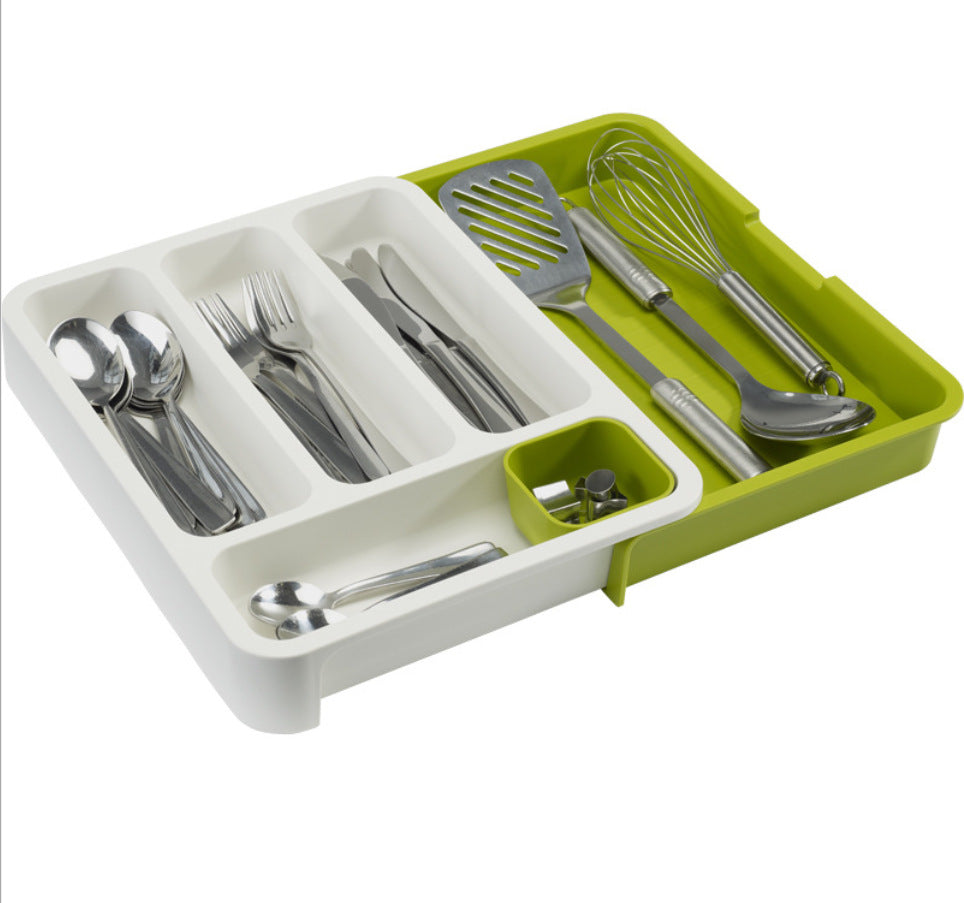 Organisateur de tiroir vu du dessus avec spatule et fouet