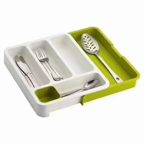 Organisateur de tiroir blanc et vert avec couverts et spatule