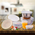 Six couvercles en silicone transparents sur des bols de tailles différentes