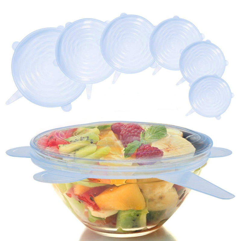 Six couvercles en silicone de tailles différentes et un bol de fruits couvert